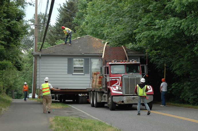 This house was donated to a cemetery as a caretaker's residence, but first it had to be relocated.