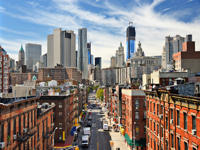 Cityscape of lower Manhattan with a blue sky