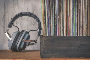 upright vinyl records in a crate