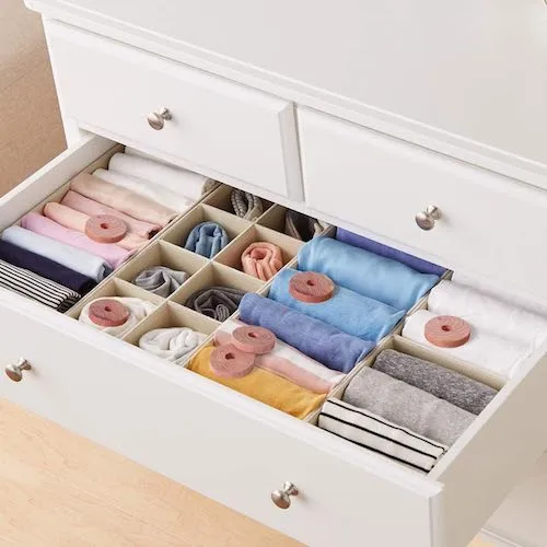 Brite Lightingtech Cedar Rings on clothes in a drawer to protect against moths and pests